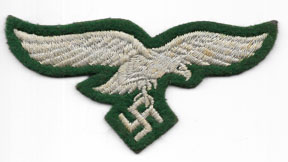 WWII German Luftwaffe Chest Eagle On Green Wool Background