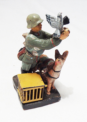 1930's era German messenger with dog and pigeon composition figure made by Elastolin.