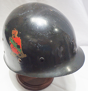 A WWII Era M1 helmet liner that has been decaled to the Air Defense Artillery