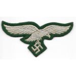 WWII German Luftwaffe Chest Eagle On Green Wool Background