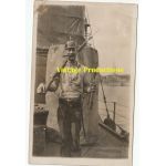 WWI era Portrait Postcard of a Doughboy on ship with War Booty.