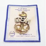 WWII Era US Navy CPO Visor Cap Device on card. Pinback. Sterling. Card has some damage. Made by GEMSCO. The insignia is super clean and unused.