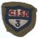 WWI 3rd General Intermediate Supply Depot. OD wool background, with a mutli-piece wool body. Unused.